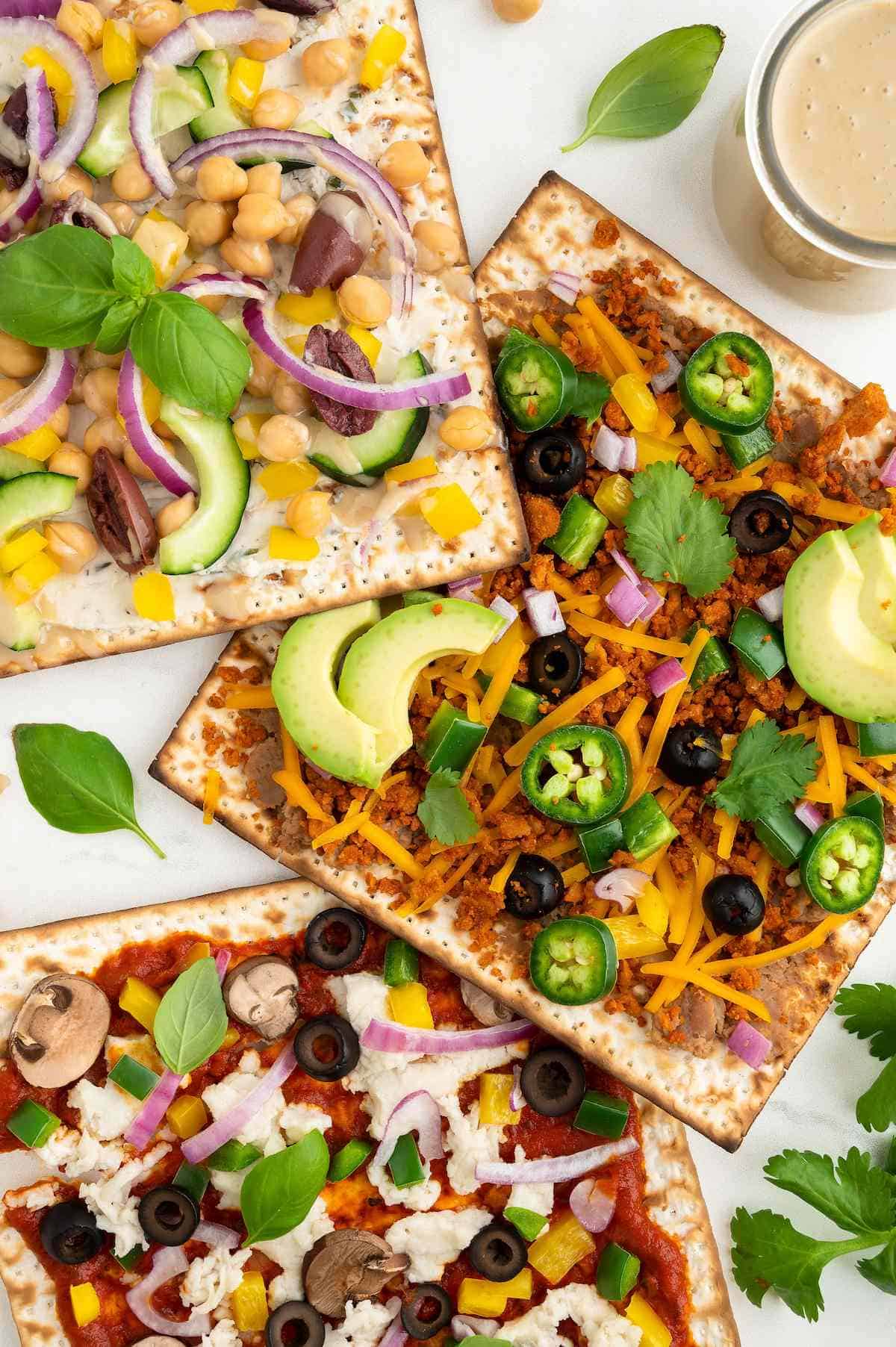 Vegan matzah pizza with different toppings.