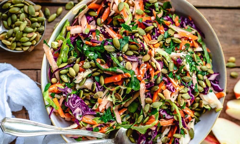 Fresh Apple Slaw With Cabbage and Pumpkin Seeds Served as a Vegan Side Dish or Appetizer