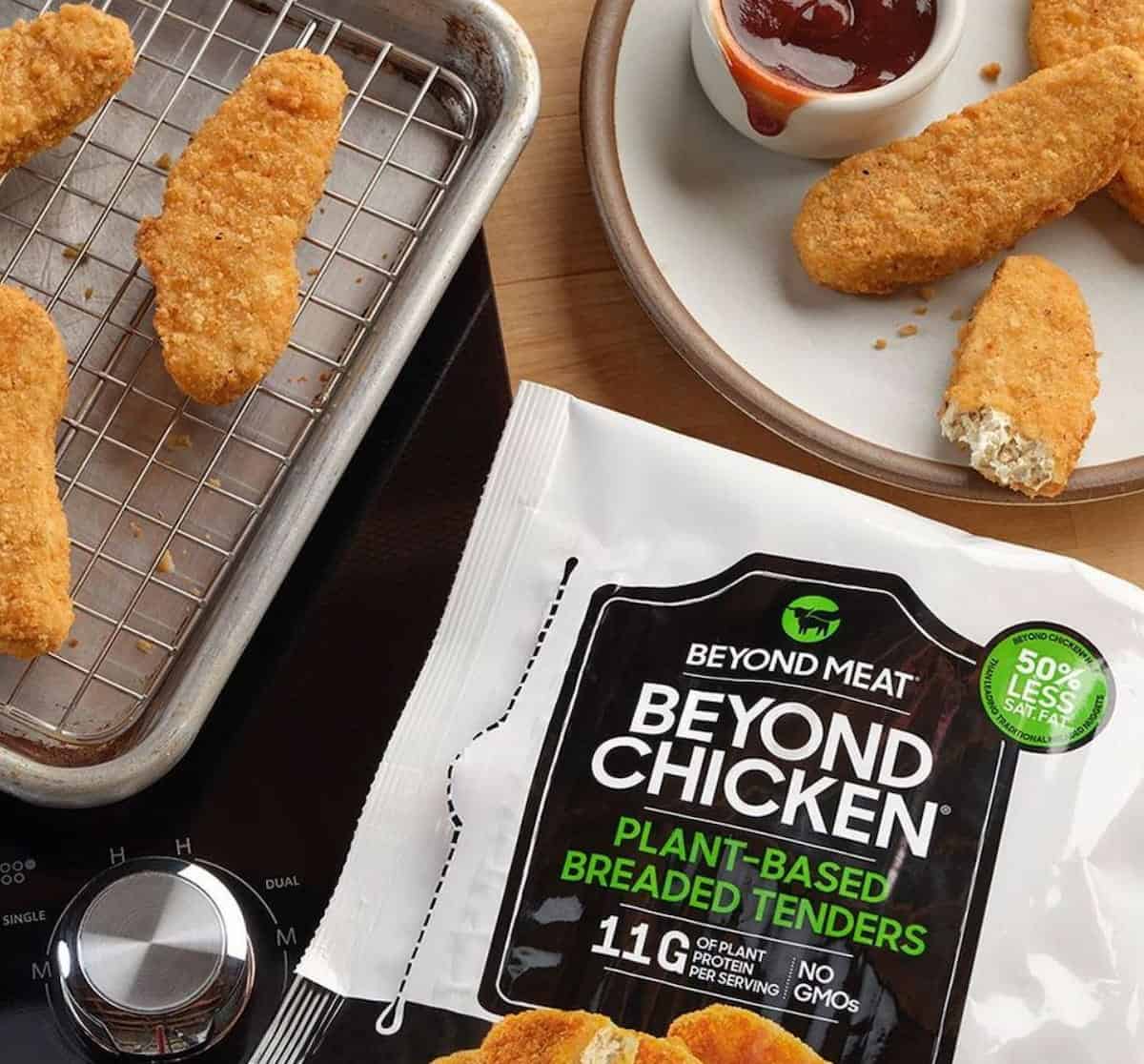 A package of Beyond Meat's Beyond Chicken, with its plant-based nuggets in the background.