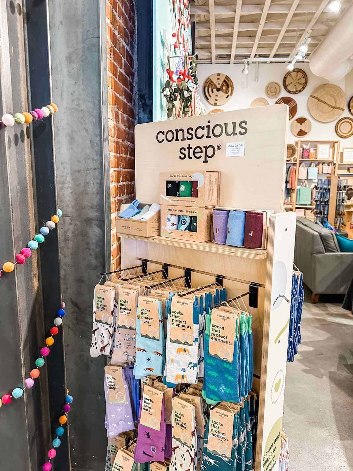 Conscious Socks store stand in a boutique fair trade eco-friendly shop in San Luis Obispo. 