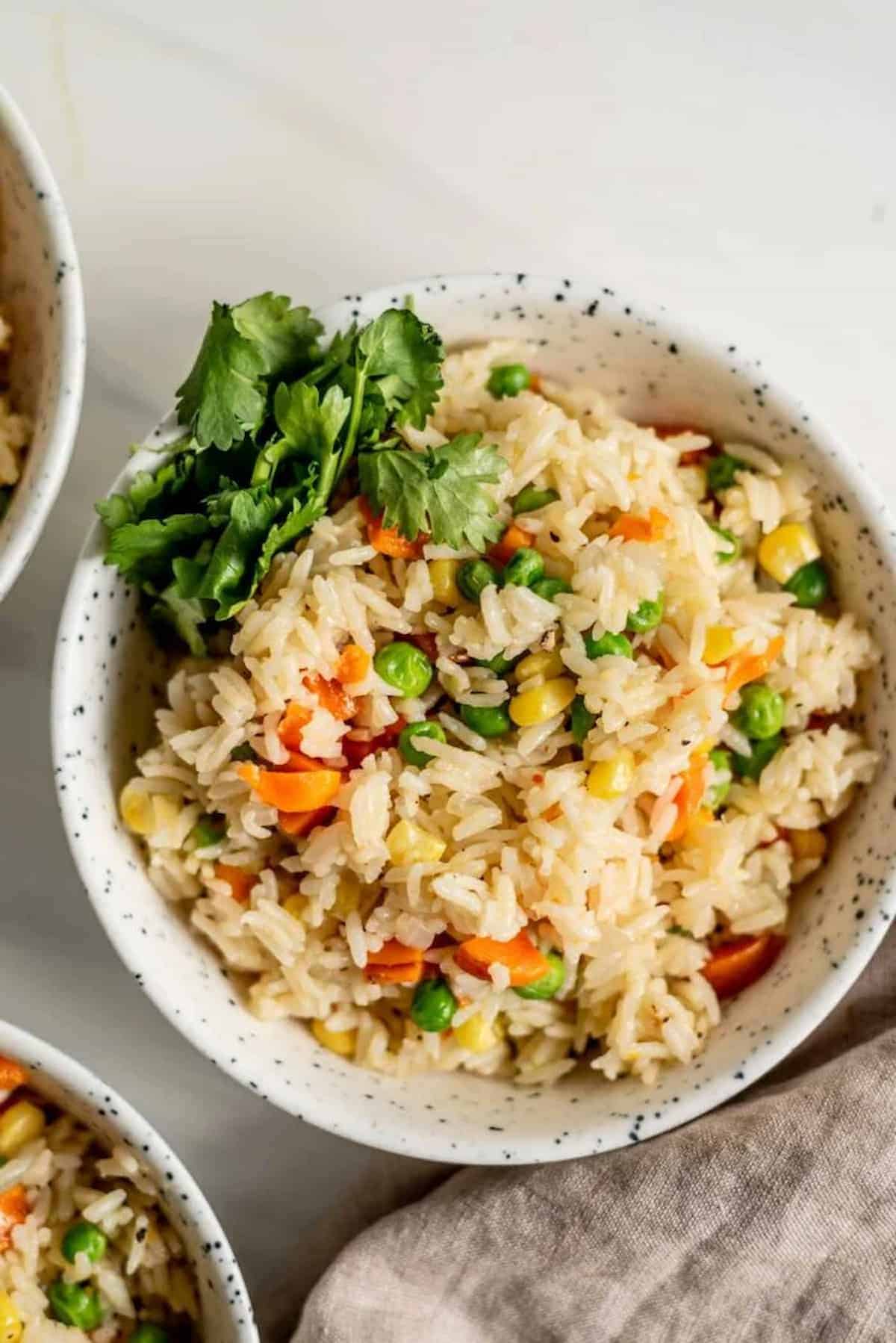 A bowl of instant pot vegetable rice pilaf.