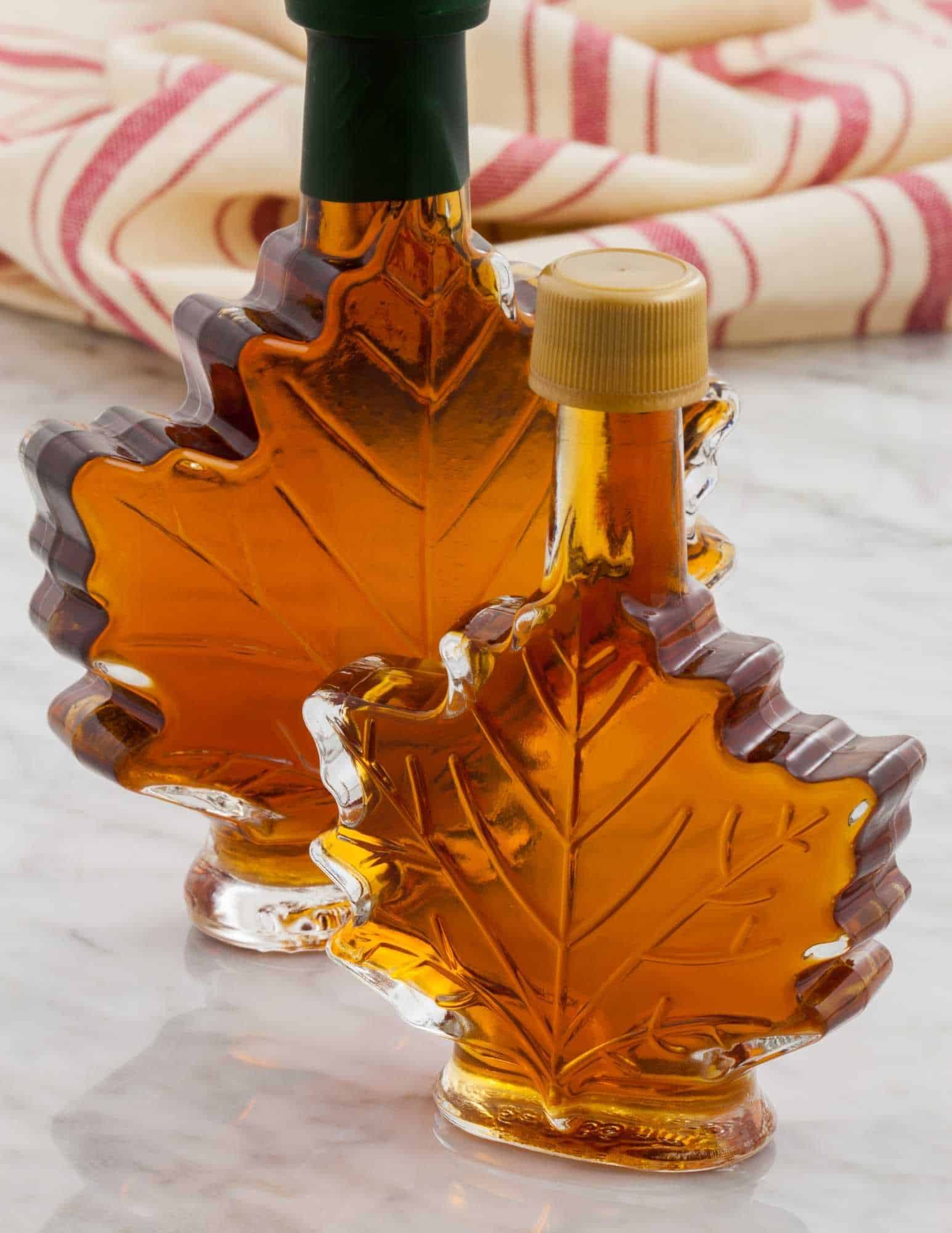 fresh maple syrup in maple glass jars