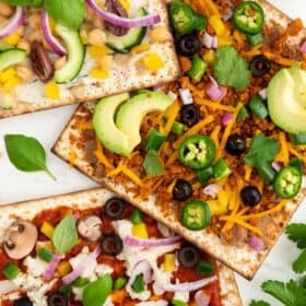 Vegan matzah pizza with different toppings for passover.