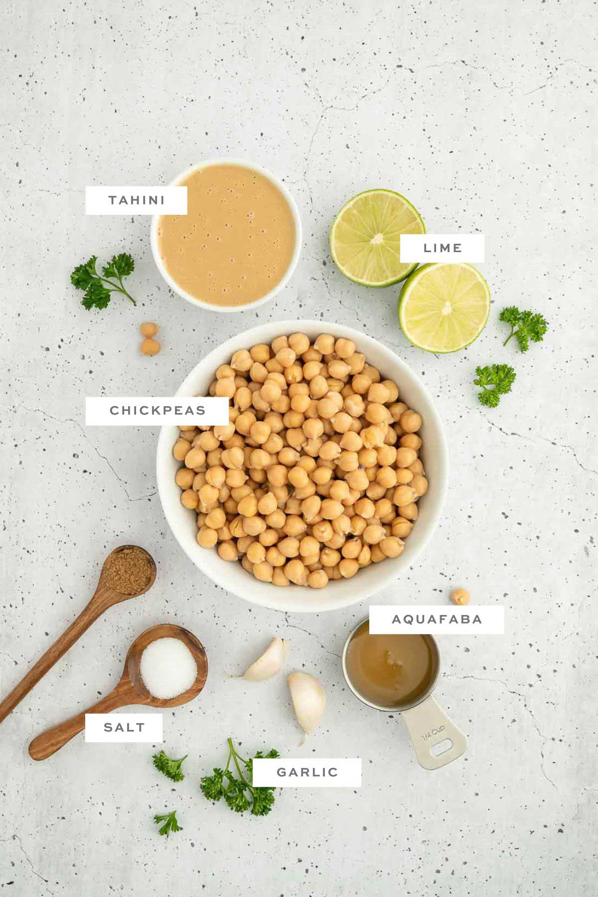 Key ingredients for oil-free hummus with labels.