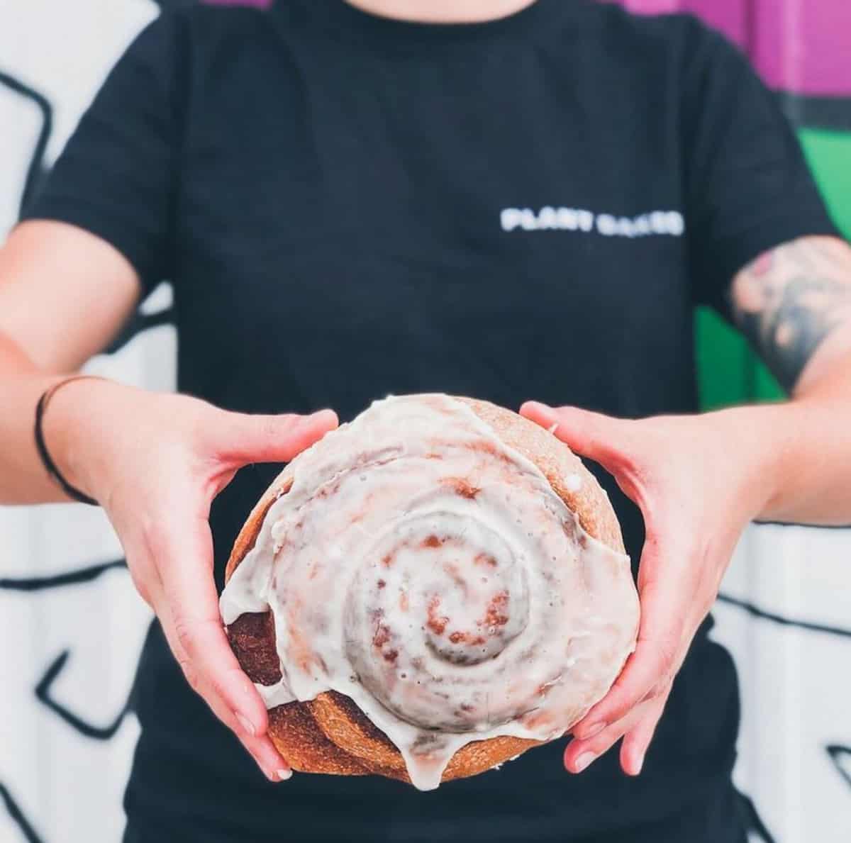 A vegan Texas-sized cinnamon roll from Skull & Cakebones plant-based bakery.