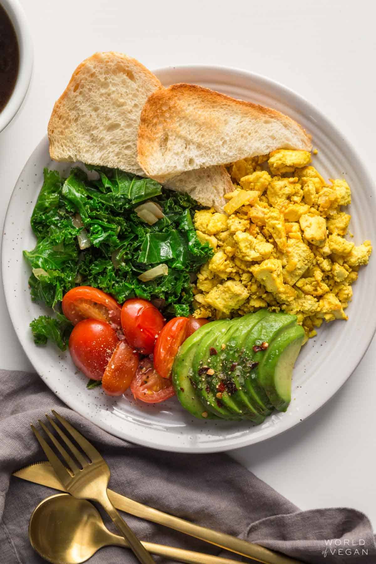 Plated tofu scramble with toast instead of eggs.
