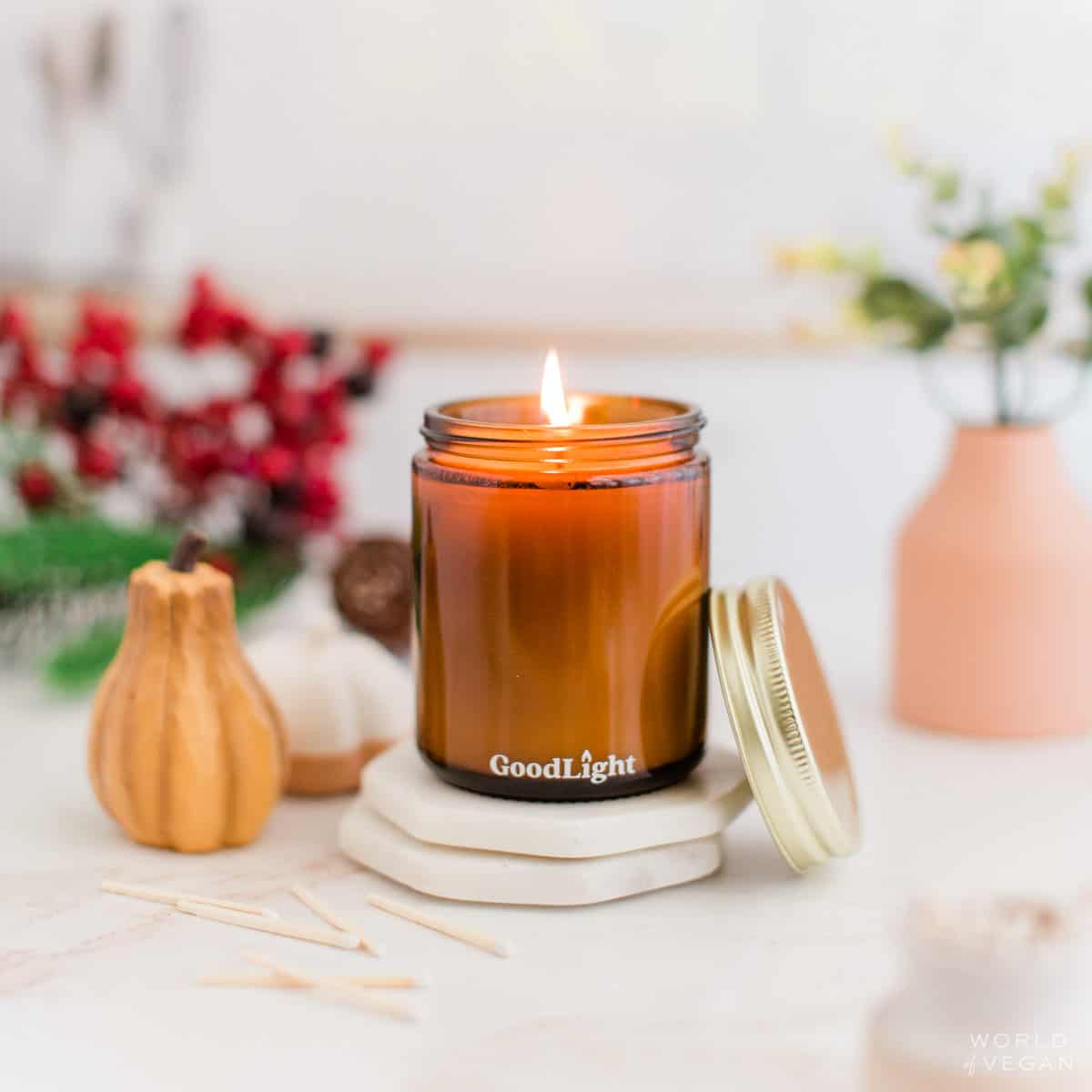 fall vegan candle in jar with pumpkin and holiday decor