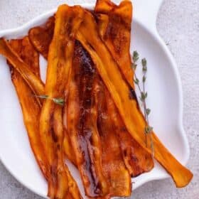 Vegan carrot bacon on a plate.