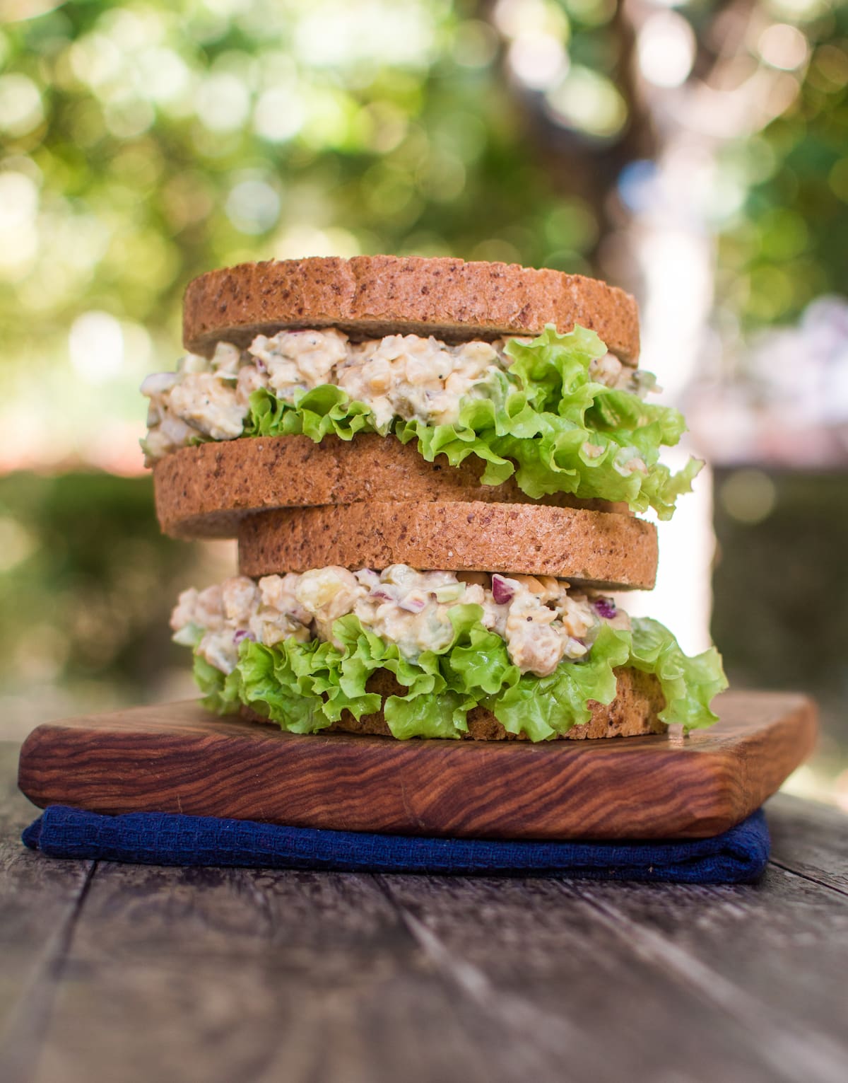 Vegan chicken salad served in a sandwich with lettuce.