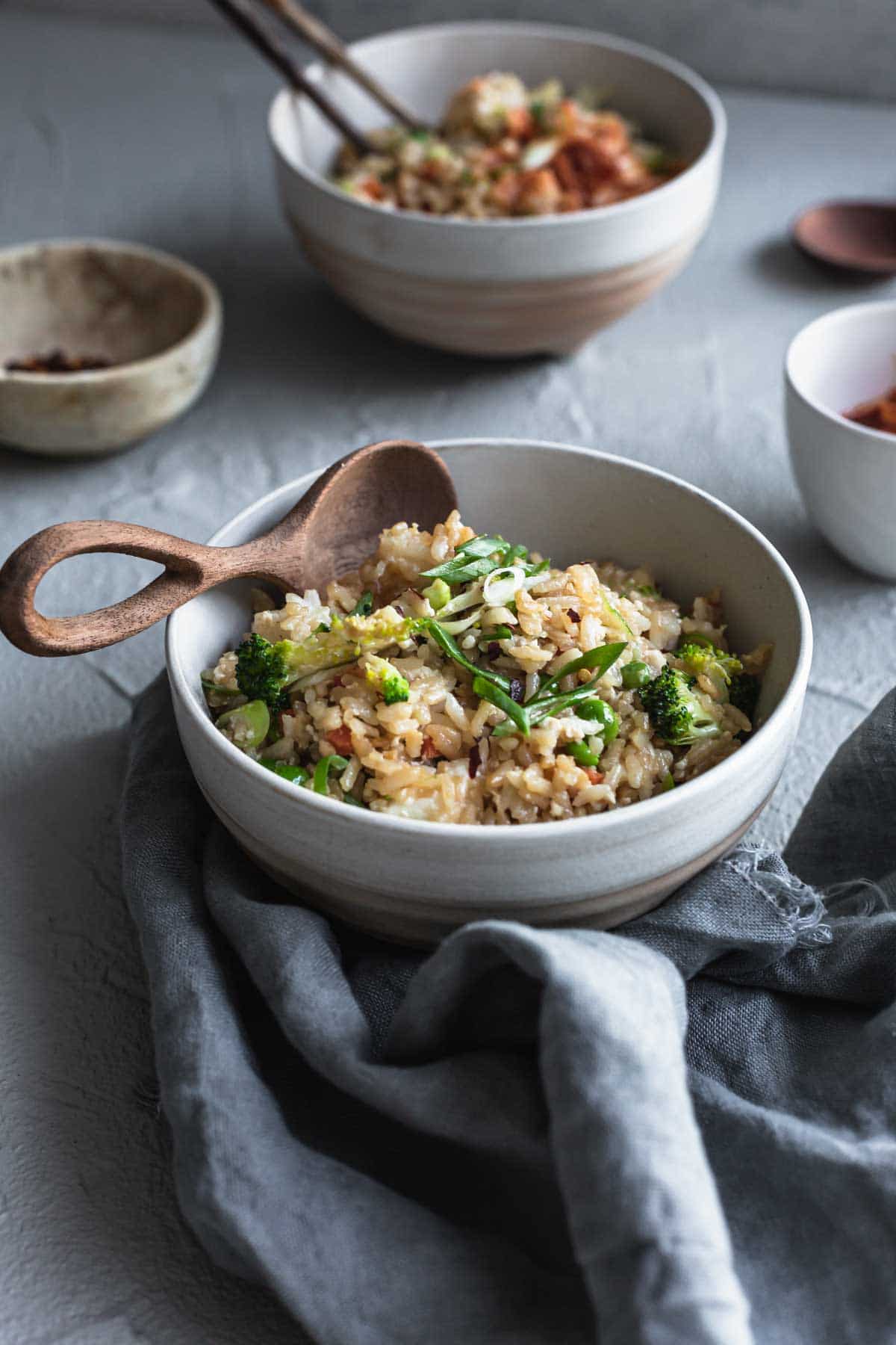 vegan fried rice in a bowl with broccoli and other veggies