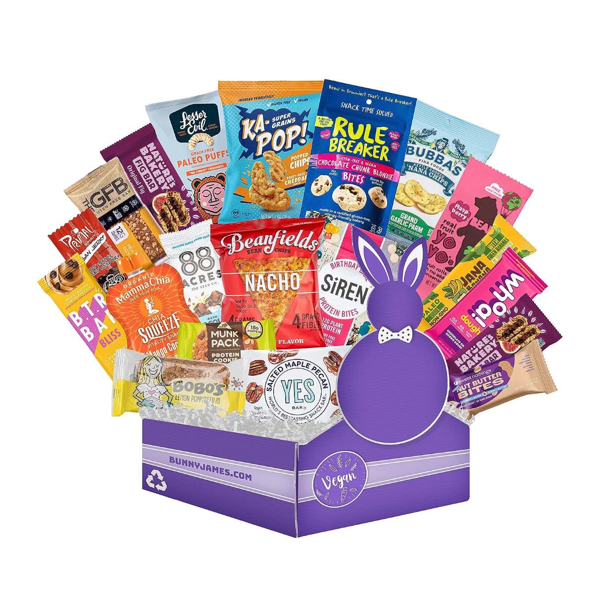 A purple box filled with dozens of vegan snacks as a gift basket.