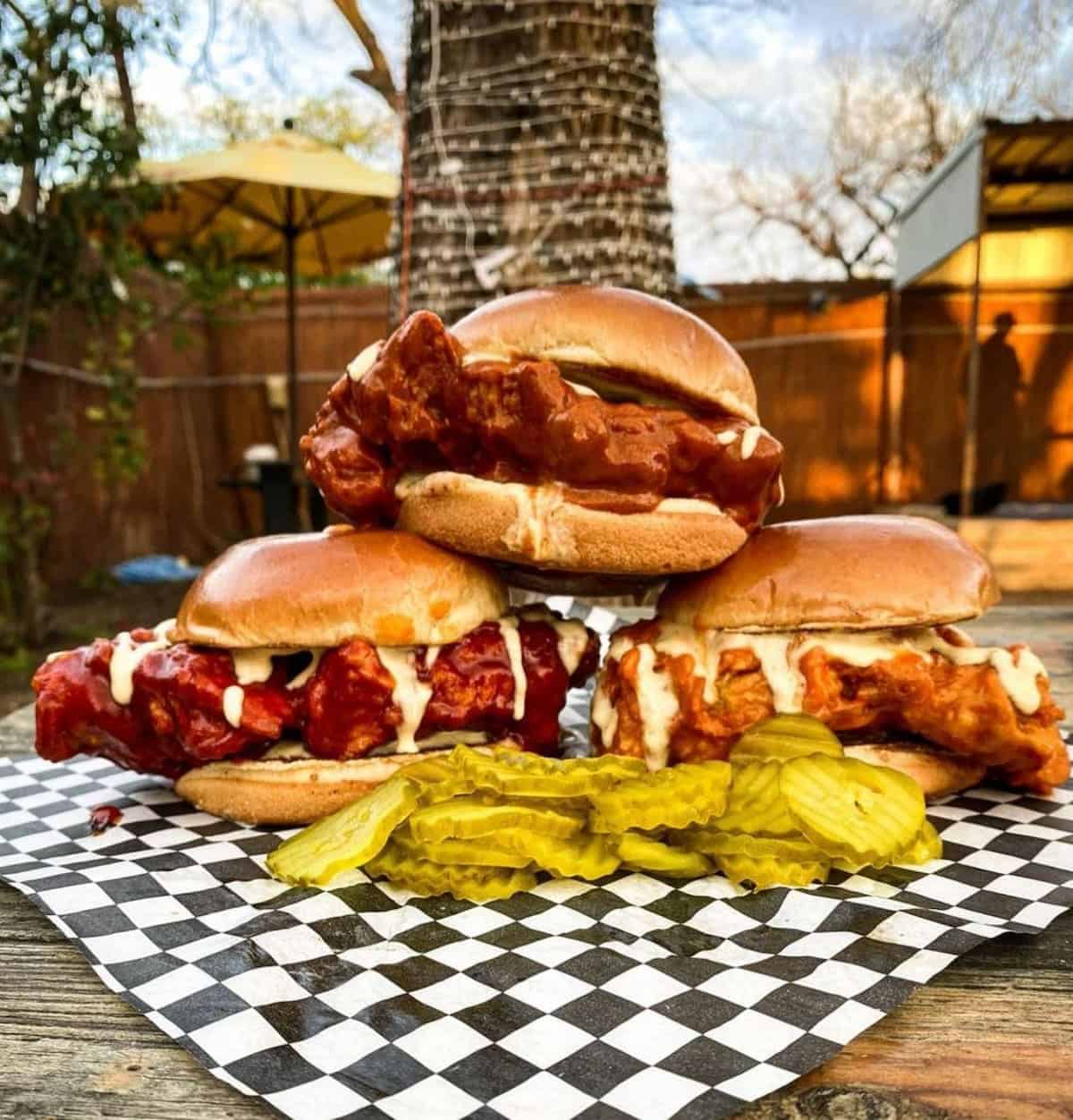 A stack of vegan hot chicken sandwiches at Sunny's Backyard.