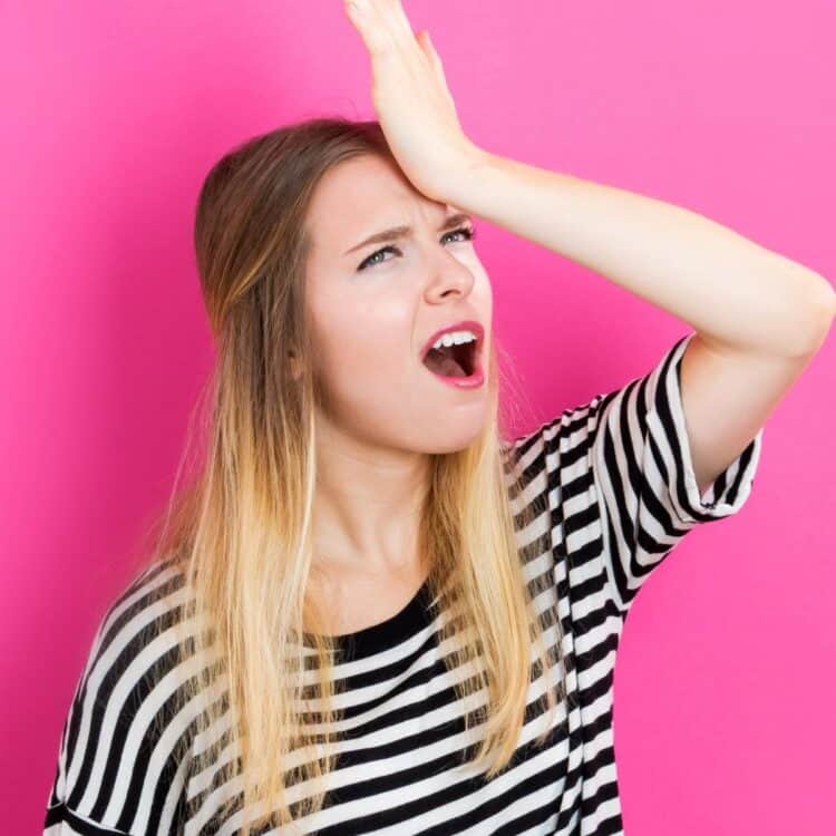 woman who just made a vegan mistake banging her head with her hand.
