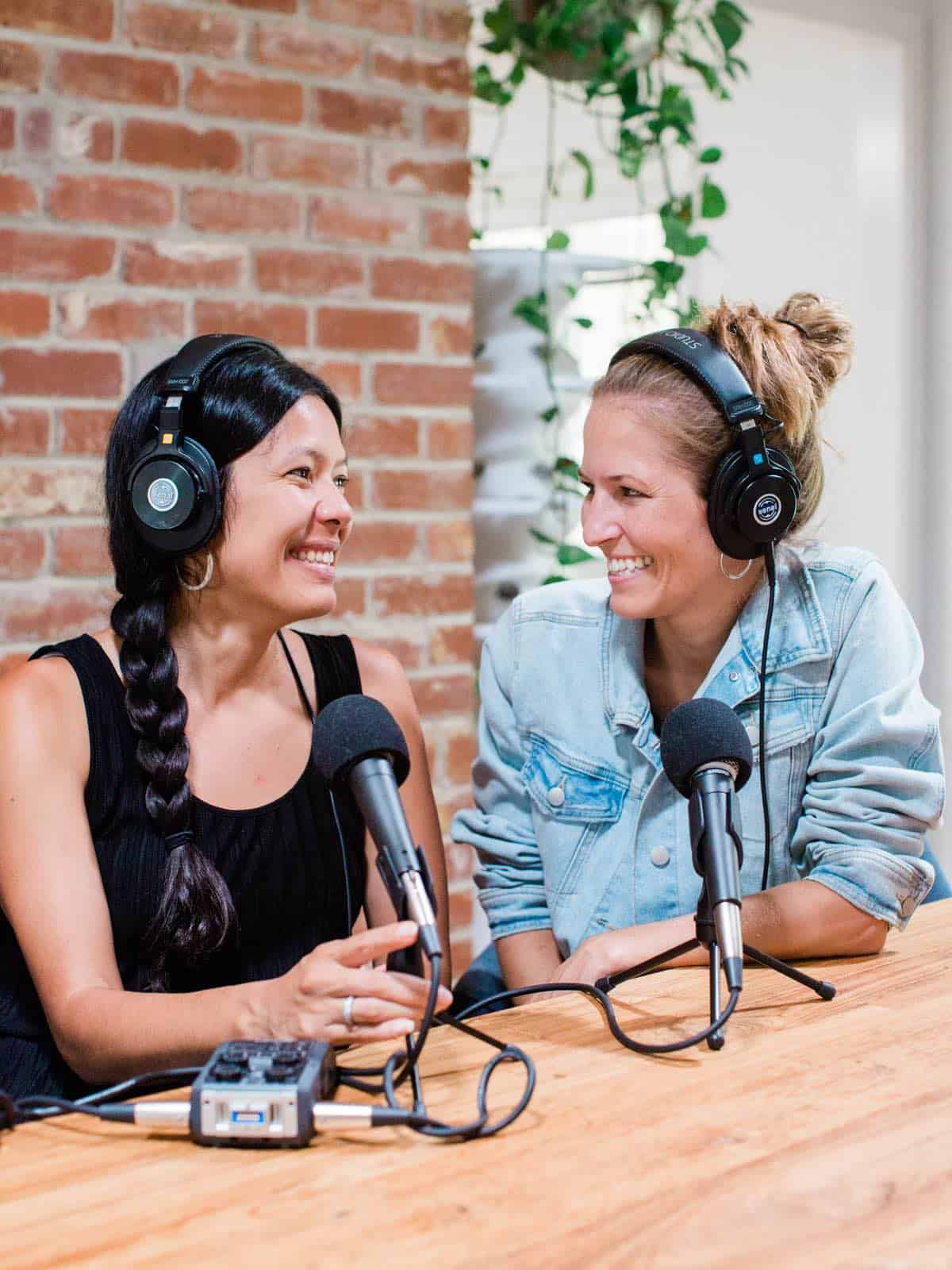 Vegan podcast hosts Toni Okamoto and Michelle Cehn recording episodes of The Plant-Powered People Podcast. 