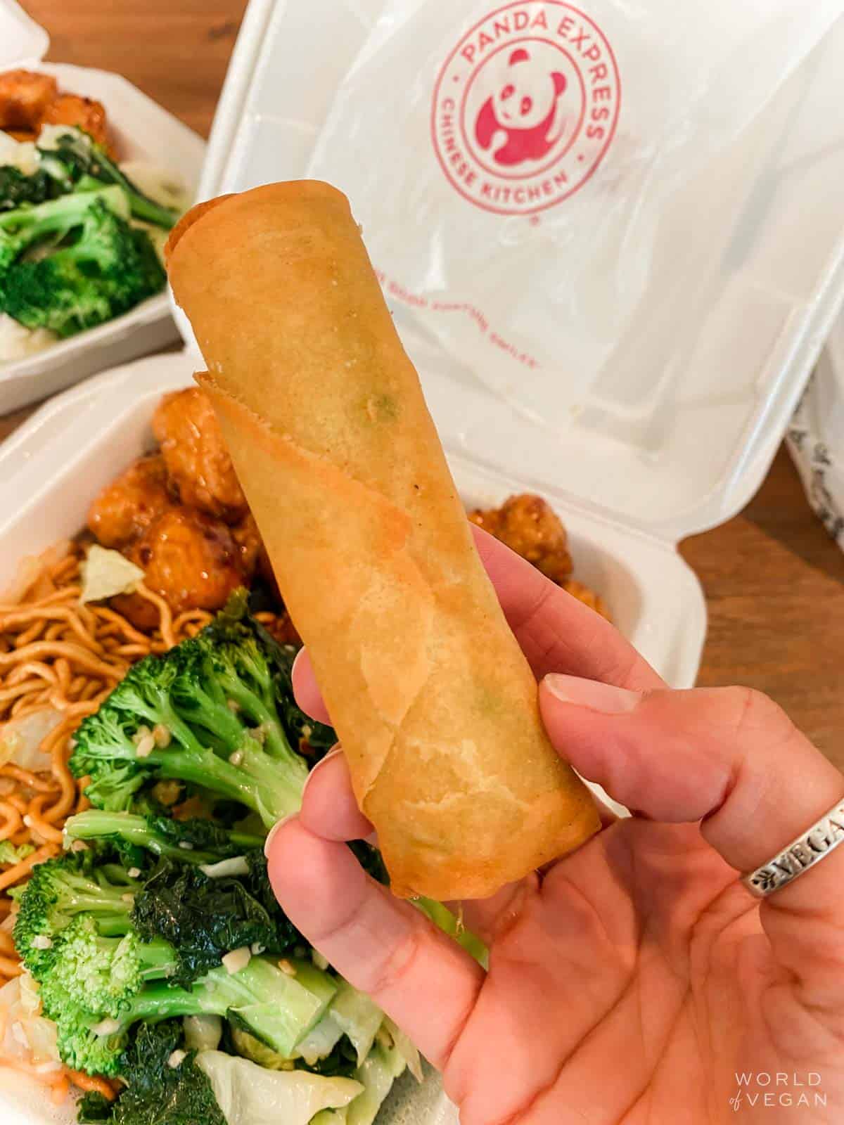 vegan spring rolls from panda express with a takeout box of food